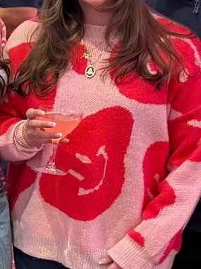 Oversized Women's Pink and Red Smiley-Print Sweater